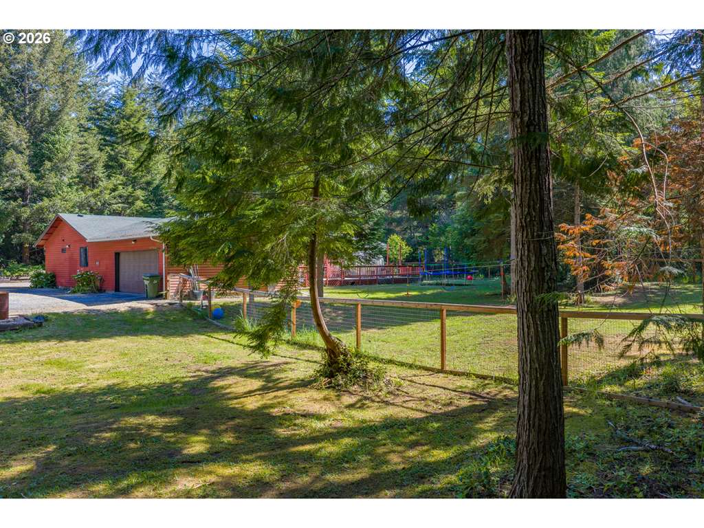 Wide aerial showing the home, shop, and acreage